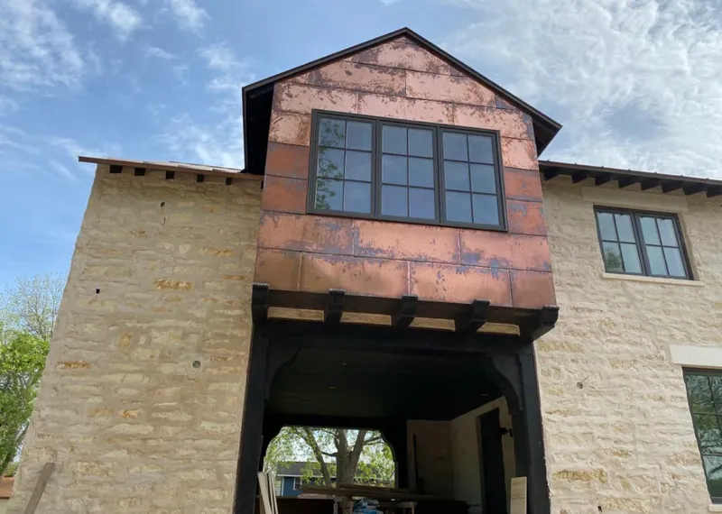 Copper metal panel facade on a stone building for Skylight Installation in Raritan